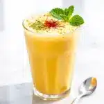 creamy mango lassi with cardamom - featured image