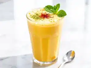 creamy mango lassi with cardamom - featured image