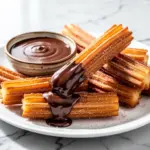 homemade cinnamon sugar churros - featured image