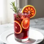 sparkling pomegranate rosemary mocktail - featured image